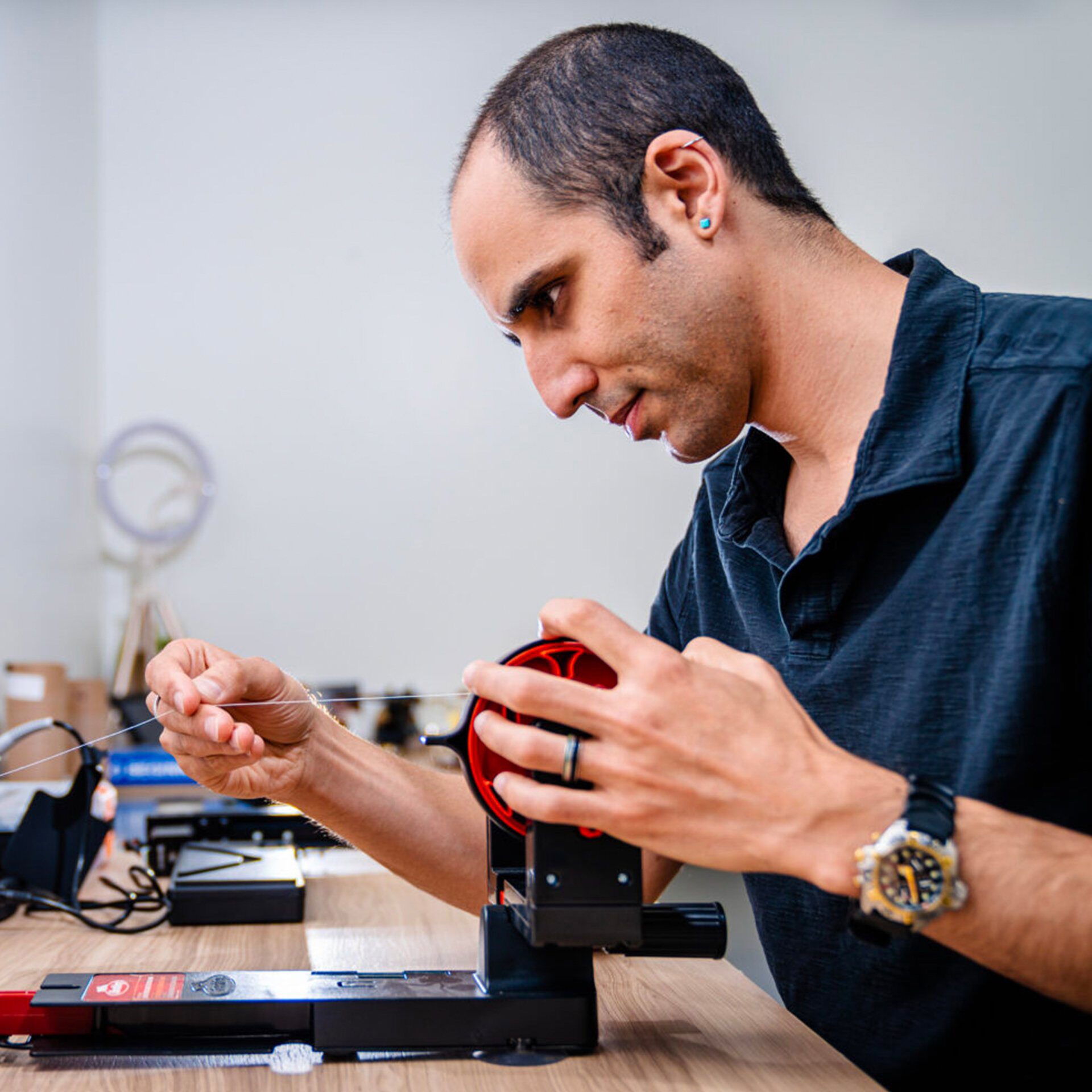 Oliver Shafaat in the Sci-Lume Labs studio