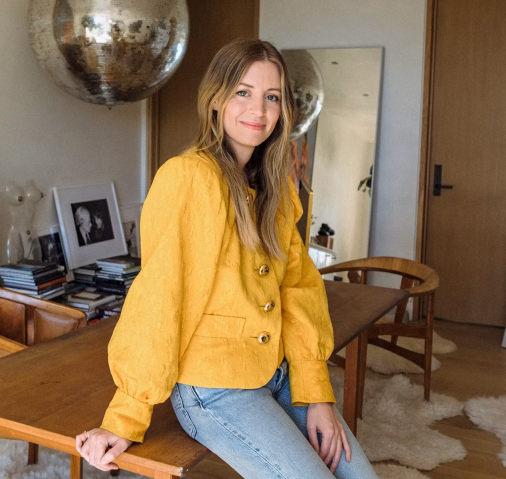 Lizzie Grover Rad posing in edge of table
